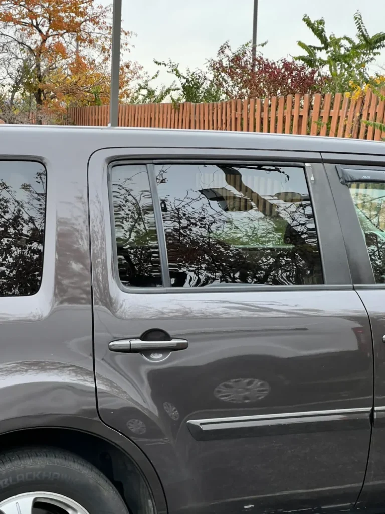 An SUV with a newly replaced side window