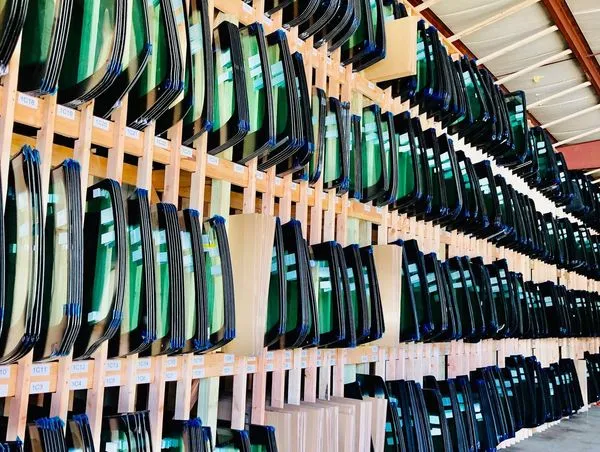 A shelf full of windshields